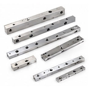บล็อกกระจายแรงดันและรางนำศูนย์เจาะรูความแม่นยำสูง Precision Drilled Manifold Blocks